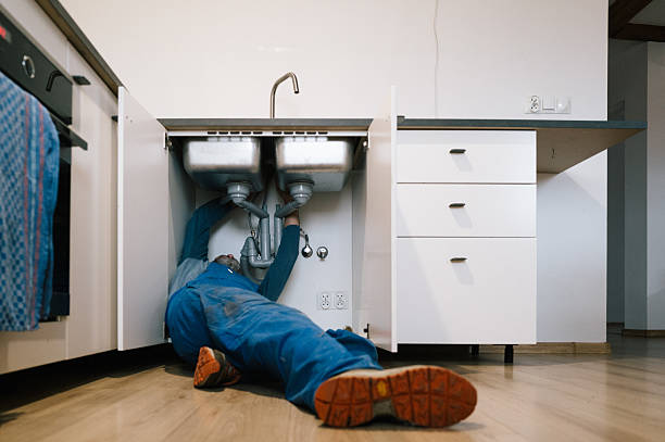 Professional Drain Cleaning technician working in Urbana, IN